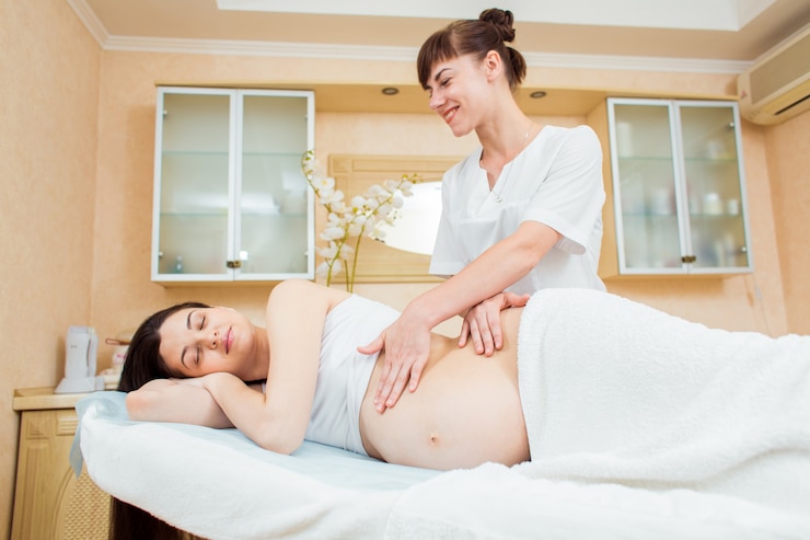 A woman is enjoyingg our Prenatal massage therapy Buffalo NY